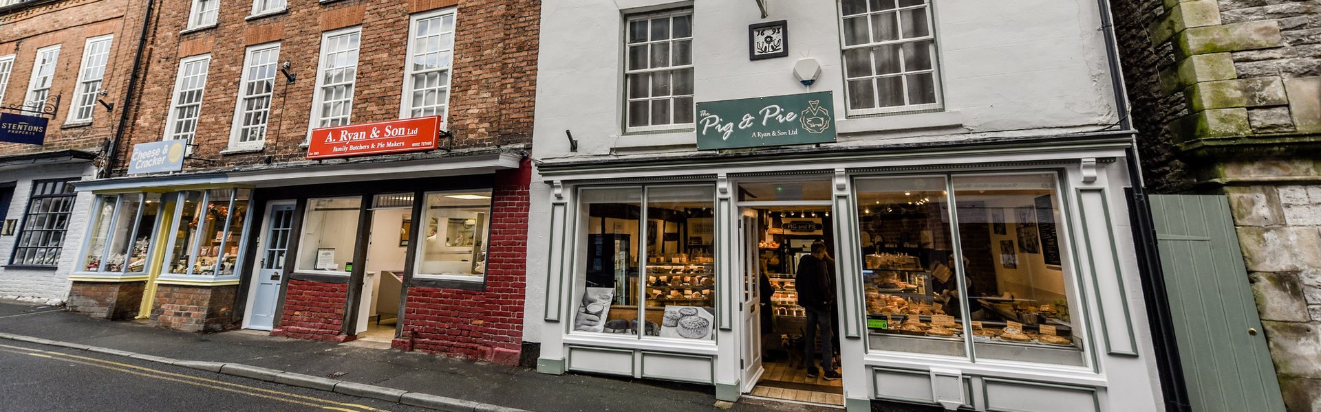 A Ryan & Son and Pig & Pie shopfronts, High Street, Much Wenlock